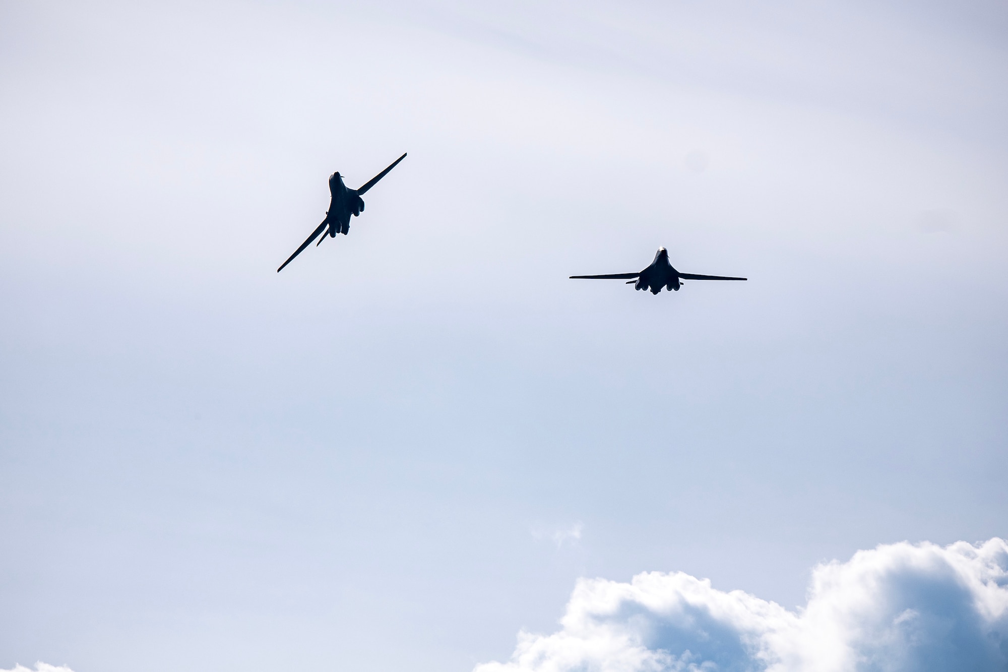 Two B-1B Lancers from the 9th Expeditionary Bomb Squadron fly overhead at RAF Fairford, United Kingdom, May 23, 2023 for Bomber Task Force Europe 23-3. The U.S. is dedicated to our security commitments to the NATO Alliance and our global Partners. We routinely operate across the glove and are flexible and agile to respond to the changes in the operational environment. (U.S. Air Force photo by Staff Sgt. Eugene Oliver)
