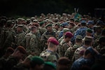Romanian military service members mass between U.S. formations at the opening ceremony as part of Saber Guardian 23 in Slobozia, Romania, May 29, 2023. The exercise, a component of Defender Europe 23, is led by Romanian Land Forces and the U.S. Army in Romania to improve the integration of multinational combat forces.