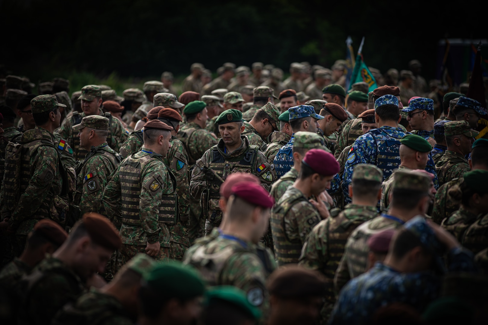 Romanian military service members mass between U.S. formations at the opening ceremony as part of Saber Guardian 23 in Slobozia, Romania, May 29, 2023. The exercise, a component of Defender Europe 23, is led by Romanian Land Forces and the U.S. Army in Romania to improve the integration of multinational combat forces.