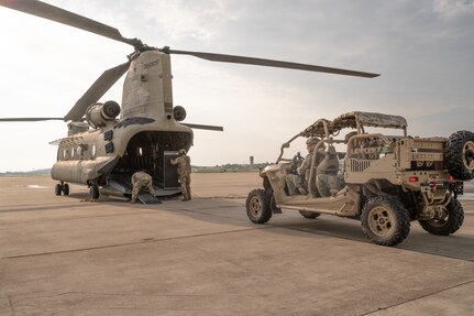 SPEARS students prepare to load their MRZR vehicle on a CH-47 Chinook that will transport them into an austere training environment May 25, 2023, at Ebbing Air National Guard Base, Ark. The MRZR is engineered to meet the demands of emergency response operation in various terrains and environments.