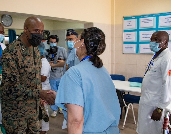 AFRICOM commander shaking hands with Angola medical personnel.