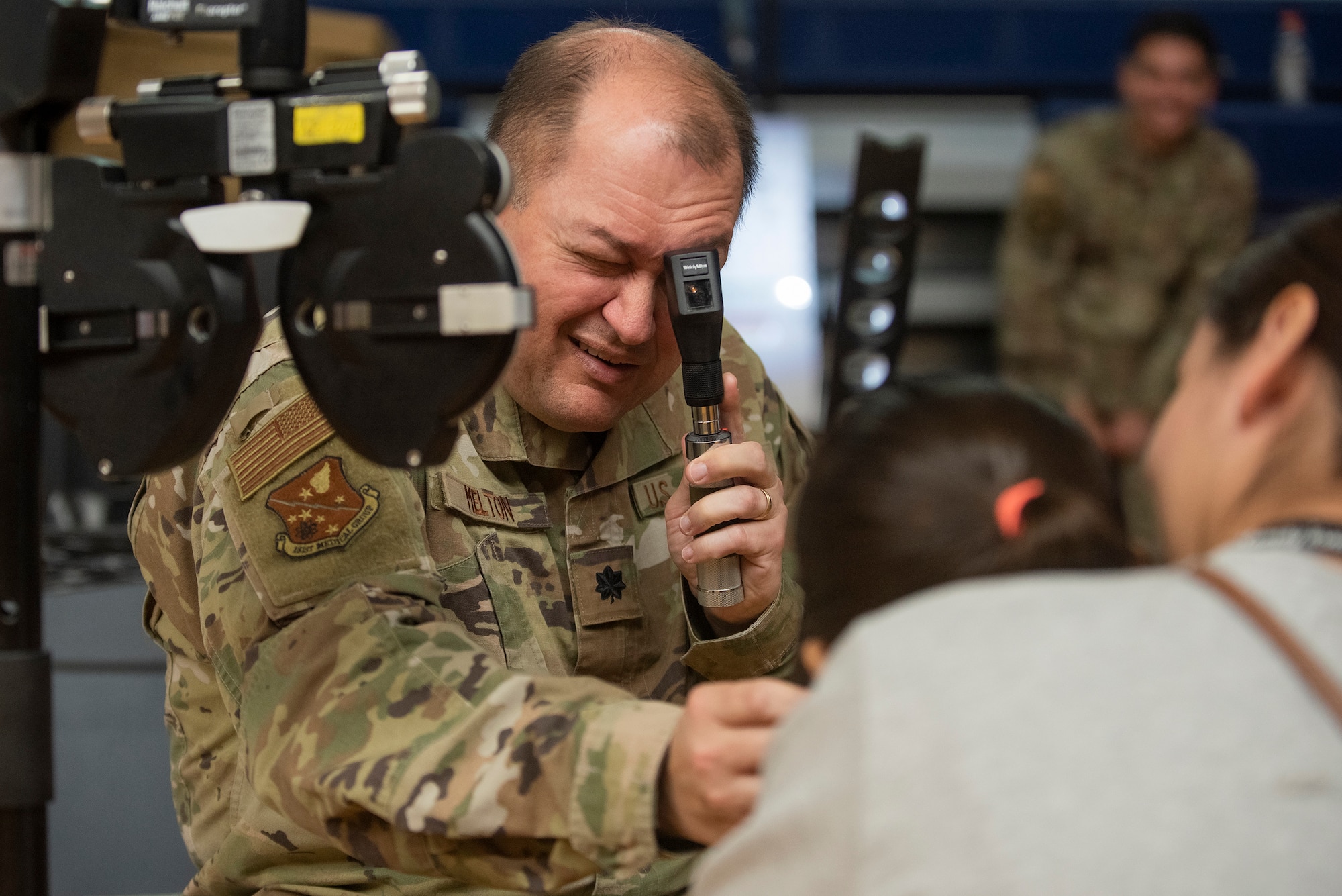 Image of Soldiers and Airmen providing medical care.