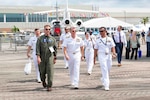 U.S. Navy Cmdr. Eric Reeves, left, and Lt. Cmdr. Chunchun Meares, right, escort Adm. Samuel Paparo, Commander, U.S. Pacific Fleet to static displays during the Langkawi International Maritime and Aerospace Exhibition (LIMA) 2023 Malaysia at the Mahsuri International Exhibition Centre, May 24. LIMA 2023 brings together government and military leaders to promote good will, strengthen cooperation and serve as an ideal platform for world’s navies to showcase their prowess, air and sea power, naval diplomacy, and cooperation in a global arena.