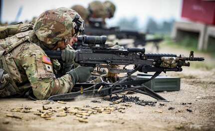 Spc. Chris Cortez, an infantryman assigned to Company C, 1st Battalion, 168th Infantry Regiment, 2nd Infantry Brigade Combat Team, 34th Infantry Division, fires an M240 machine gun during a squad live-fire at Camp Guernsey Joint Training Center in Wyoming on May 20, 2023. The Iowa National Guard unit completed two weeks of individual and collective training.