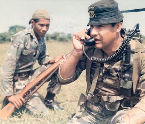 A soldier of the Mobile Training Team, U.S. Special Forces, uses an AN/PRC-10 radio to keep in touch with other members of the patrol during a training exercise with forces in the Dominican Republic. (1971)