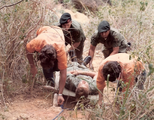 U.S. soldiers demonstrate to Venezuelan military personnel how to move with a litter up the side of a mountain during para-rescue training near Caracas. (1973)