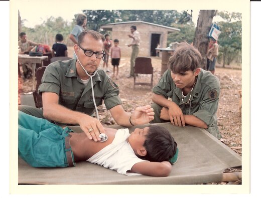 A U.S. Army medic examines a Panamanian boy during a medical training exercise in Panama, April 1974. (Source: U.S. Army Signal Corps, NARA)