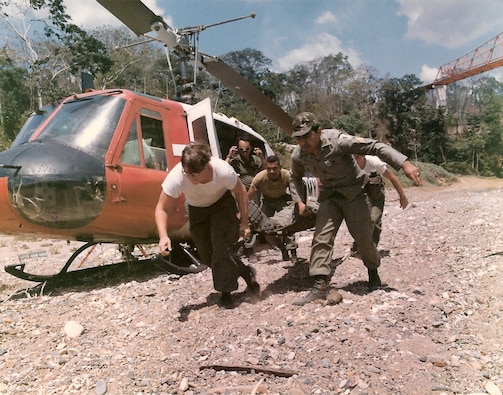 Members of the 601st Medical Co. and the Guardia Nacional take part in a refresher class on helicopter medical evacuations, near Maje, Panama. (1974)
