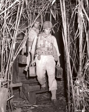 U.S. infantrymen carry ammunition to a machine gun position, Panama, October 1942.  (Source: U.S. Army Signal Corps, NARA)
