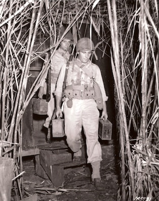 U.S. infantrymen carry ammunition to a machine gun position, Panama, October 1942.  (Source: U.S. Army Signal Corps, NARA)