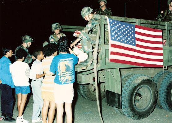 U.S. soldiers distribute relief aid during Operation Just Cause in Panama - December, 1989.