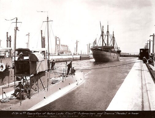 A U.S. submarine, with tender ship USS Severn, passes through the Gatun Locks in April 15, 1914.  (Source: U.S. Marine Corps, NARA)