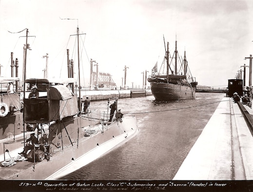 A U.S. submarine, with tender ship USS Severn, passes through the Gatun Locks in April 15, 1914.  (Source: U.S. Marine Corps, NARA)