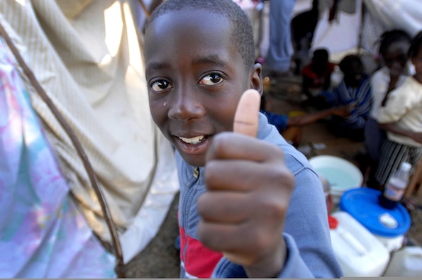 Earthquake victims in Port-au-Prince, Haiti, await continued relief efforts from U.S. service members as well as military personnel from other countries Jan. 21, 2010.