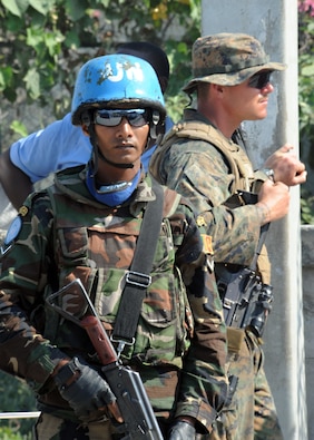 (2010) A U.S. Marine Corps corporal works with UN Peacekeepers in Haiti