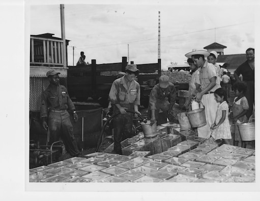 U.S. Army personnel deliver water to flood victims at San Pedro Sula, Honduras, October 1954.  From its inception, the U.S. Caribbean Command undertook humanitarian operations in Latin America and the Caribbean.  (Source: Department of Defense, NARA)