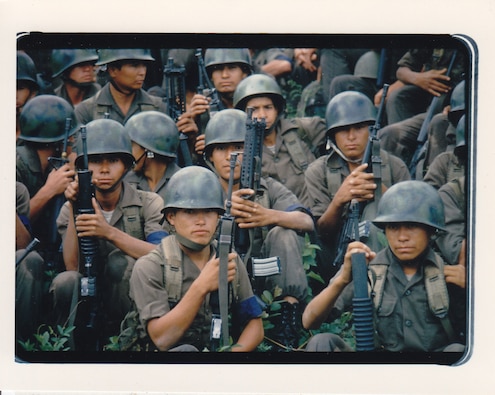 Members of the 7th Battalion, Honduran Army, gather for a briefing, 7th Special Forces Group, U.S. Army, during a bilateral training exercise, June 1984.  (Source: Department of Defense, NARA)