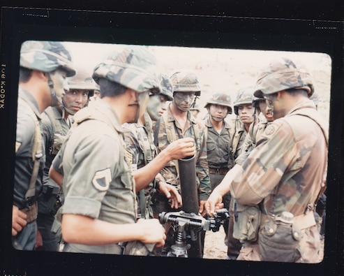 Soldiers from the 16th Infantry Battalion, Honduran Army, operate a mortar for members of the 82nd Airborne Division during a Task Force Dragon/Gold Pheasant exercise, March 1988.