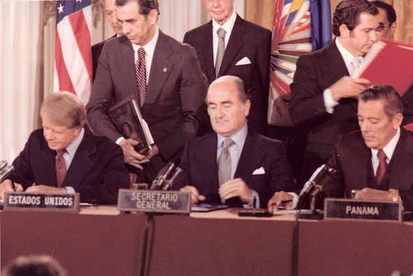 President Carter, OAS Secretary General Alejandro Orfila, and General Torrijos sign the Panama Canal Treaties in Washington, September 1977. (Source: U.S. Information Agency, NARA)