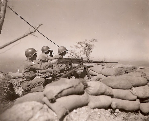 Colombian troops fire a .50-caliber machine gun at an enemy position in central Korea, October 1951.  During the Korean War, the U.S. Caribbean Command supported the Colombian military deployment with training and equipment.  (Source: U.S. Army Signal Corps, NARA)