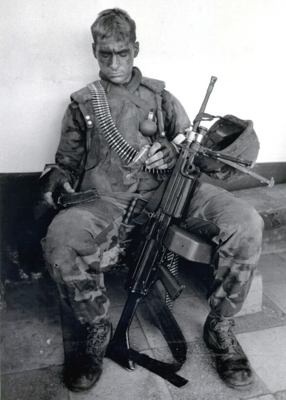 A U.S. Marine from Delta Co., 2nd Light Armored Infantry Bn. takes a break in the fighting with Panamanian Defense Forces during Operation Just Cause in Dec. 1989.