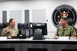 U.S. Space Force Lt. Gen. John Shaw, U.S. Space Command deputy commander speaks with U.S. Navy Vice Adm. Richard Correll, U.S. Strategic Command deputy commander at Peterson Space Force Base, Colo., May 30, 2023. During the visit the two leaders discussed the ability of both commands to deter strategic attack through safe, secure, effective, and credible, global combat capabilities and when directed, ready to prevail in conflict. As a fundamental component of the modern all-domain operational environment, USSPACECOM engages with fellow defense organizations to reinforce a space warfighting culture across the Joint Force. (U.S. Space Command photo by Christopher DeWitt).
