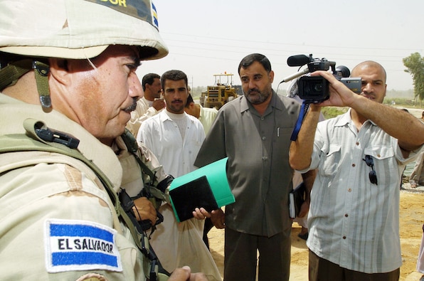 The Commander of the El Salvadorian Coalition Military Assistance Team (CIMIC) gives interview to a camera crew.