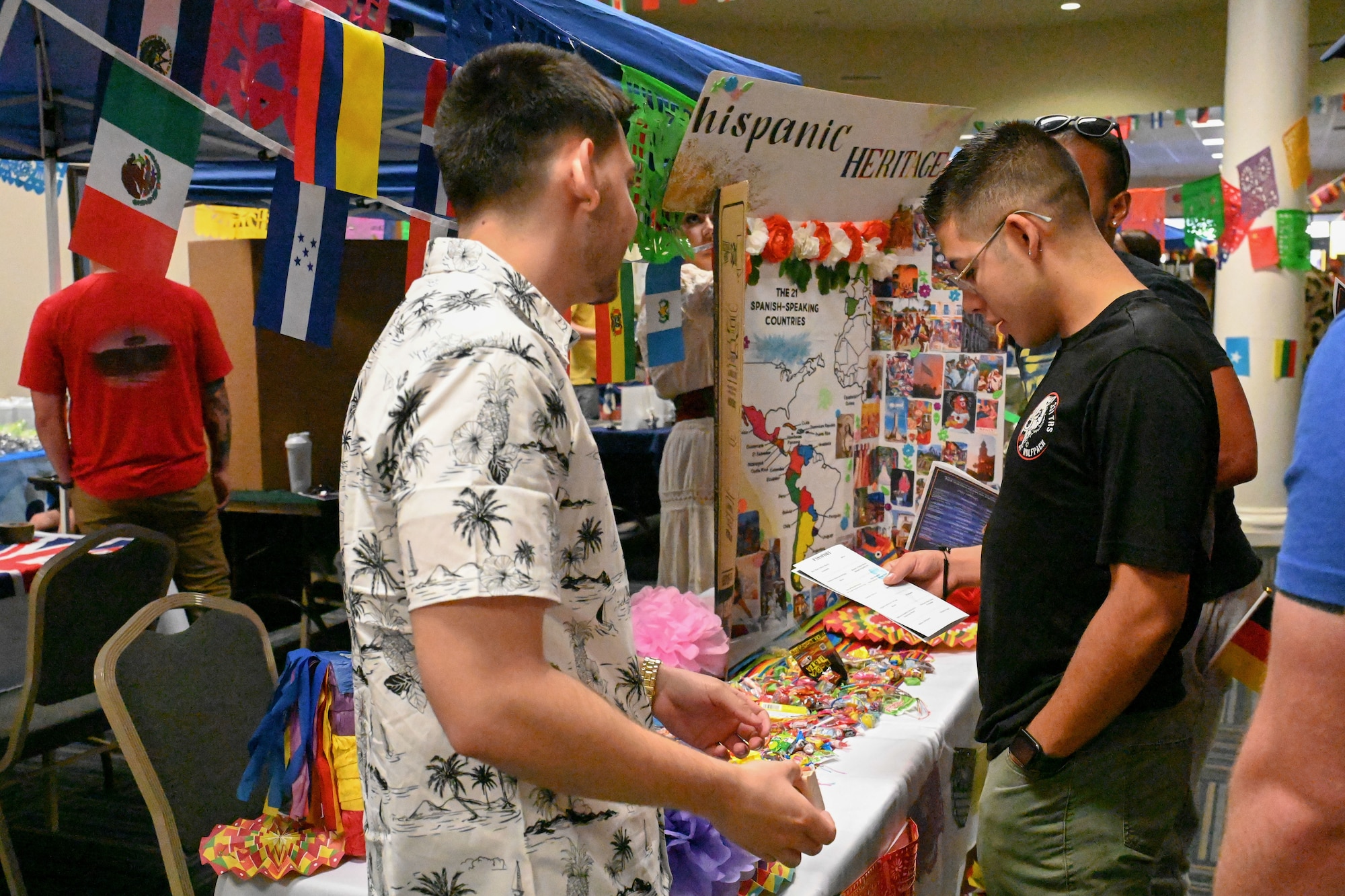 members look at a booth