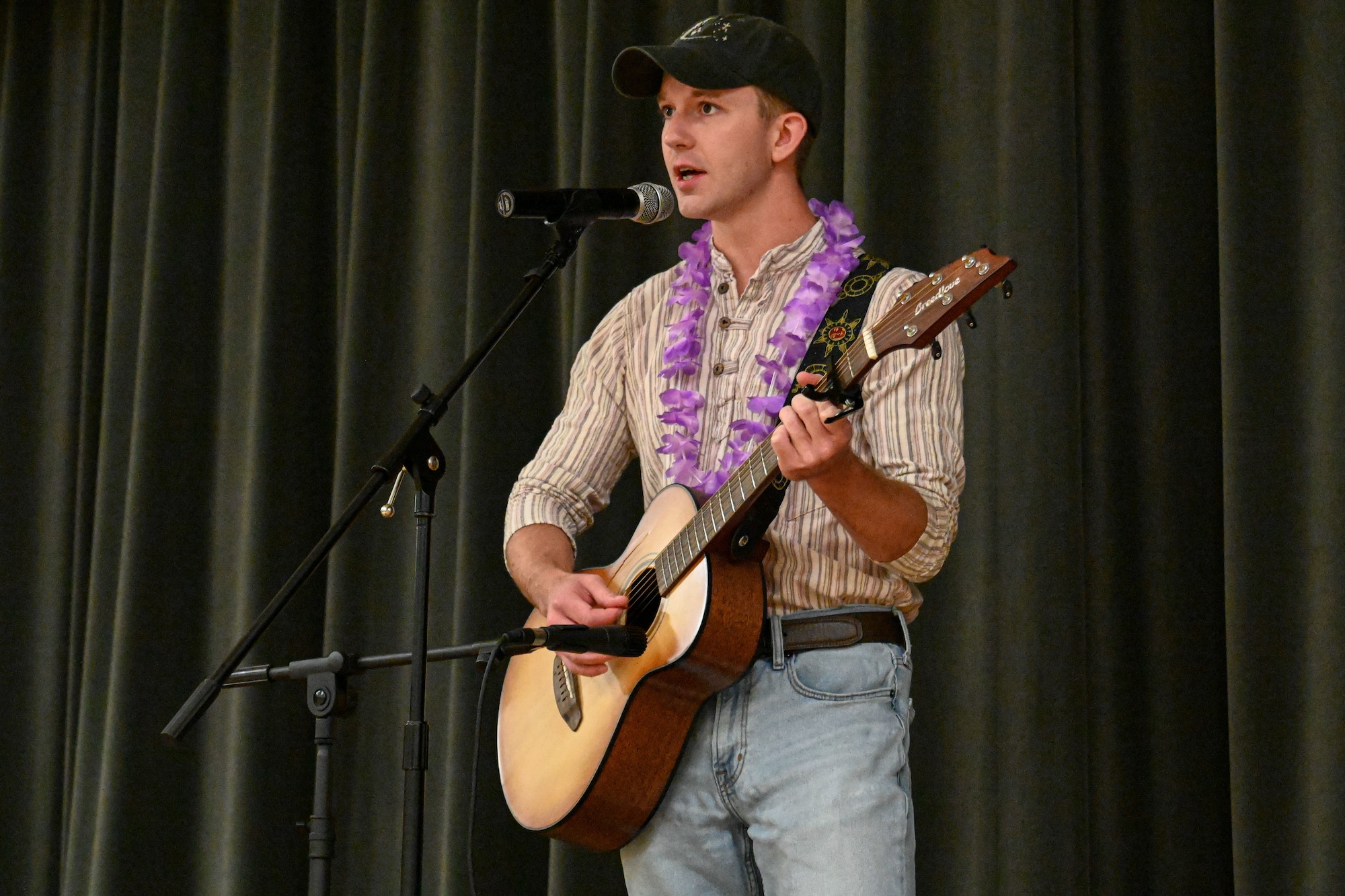 a man sings on stage