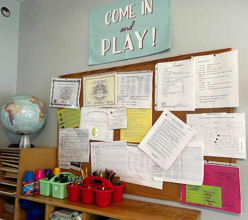 A photo of a bulletin board and papers.