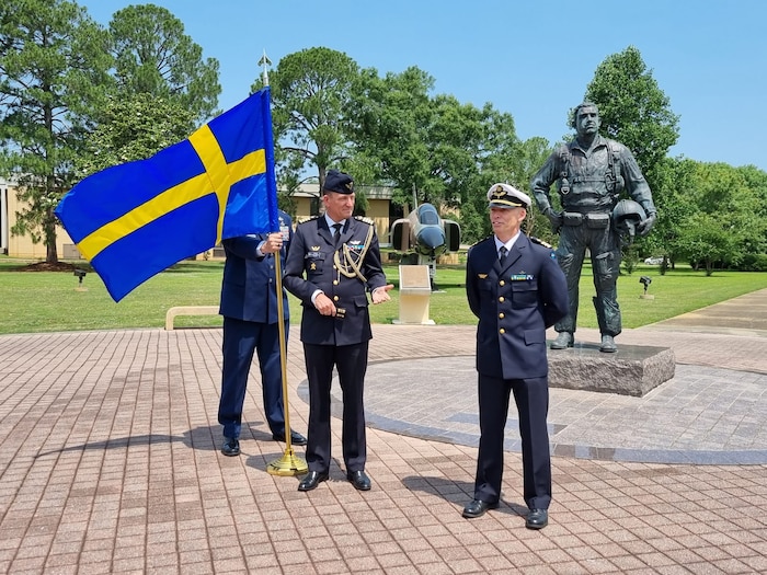 New Air Command and Staff College graduate Swedish Royal Air Force Lt. Col. Johan Jeppsson (right) offers a few words following his outdoor promotion ceremony at Air University, Maxwell Air Force Base, Alabama, May 25, 2023. Col. Jonas Nellsjo (left), air and space attaché, assistant defense attaché, Embassy of Sweden, promoted Jeppsson to his rank of lieutenant colonel.