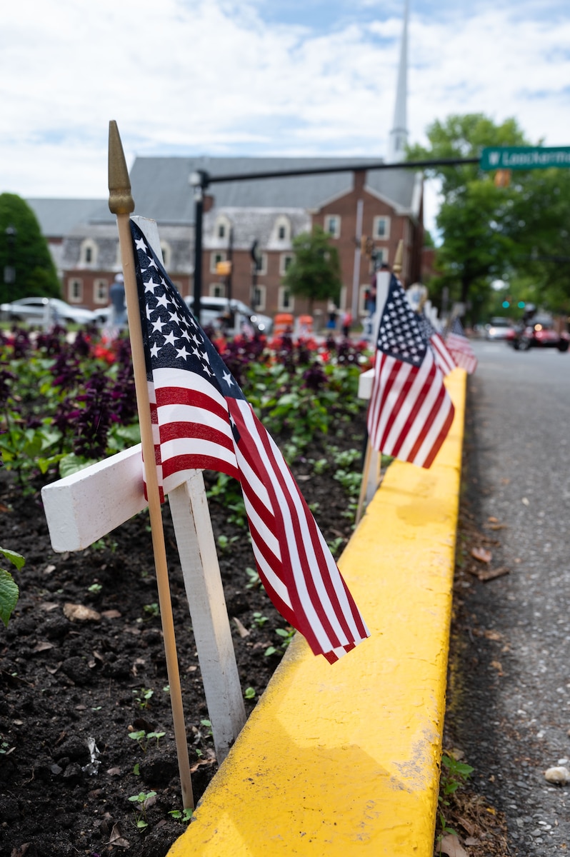 A flag waves in the wind during the 2023 Memorial Day ceremony in Dover, Delaware, May 29, 2023. Memorial Day commemorates the men and women who made the ultimate sacrifice in their service to the United States. The ceremony included remarks from Col. Bary Flack, 436th Mission Generation Group commander, a roll call of Dover veterans who died in the last year and a wreath laying ceremony. (U.S. Air Force photo by Senior Airman Cydney Lee)