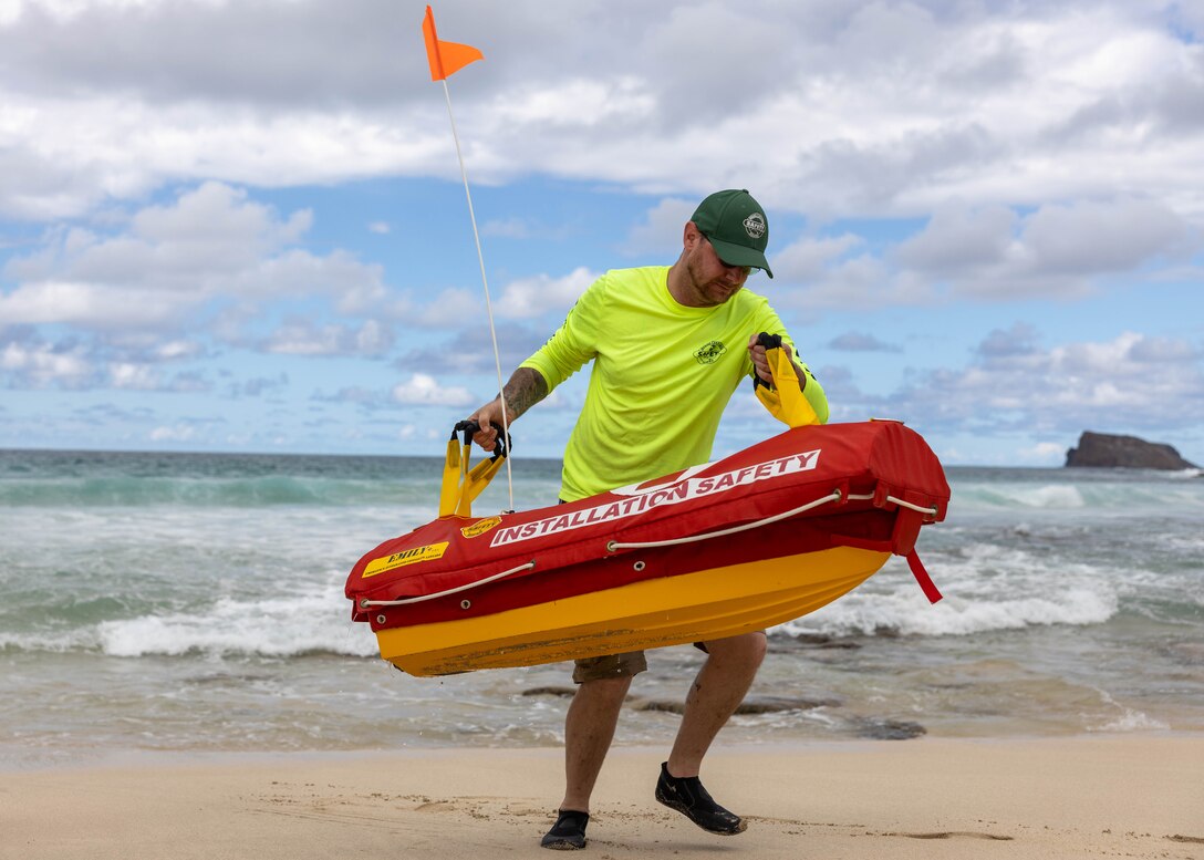 U.S. Congressmen and Congresswomen pose for a picture alongside U.S. Marine Corps Col. Speros Koumparakis, commanding officer, Marine Corps Base Hawaii, Feb. 17, 2023. The purpose of this visit was to showcase MCBH to Washington, D.C. decision-makers and appropriators with emphasis on military construction to support Force Design 2030. (U.S. Marine Corps photo by Cpl. Cody Purcell)