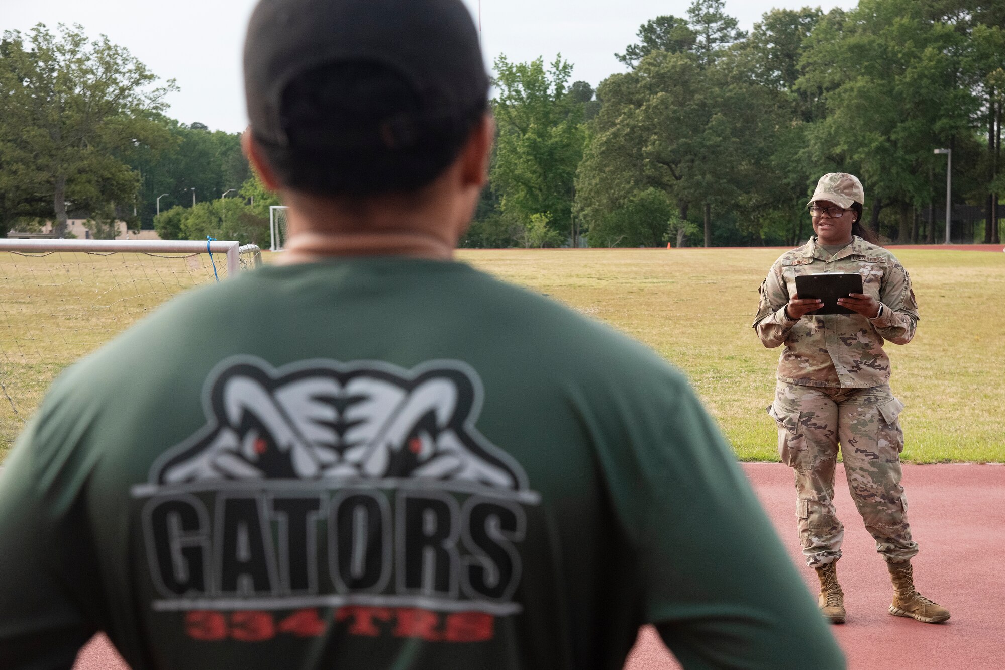 Staff Sgt. Elisea Jones, 4th Force Support Squadron fitness and sports supervisor, explains the history of the Murph Challenge to participants at Seymour Johnson Air Force Base, North Carolina, May 25, 2023. Members of Team Seymour participated in the annual Murph Challenge as a way celebrate the memory of U.S. Navy SEAL Lieutenant Michael Murphy, who paid the ultimate sacrifice for his country in 2005. His brave actions in Afghanistan and previous actions during his military tenure earned Murphy the Medal of Honor, the United States’ highest military decoration. (U.S. Air Force photo by Tech. Sgt. Christopher Hubenthal)