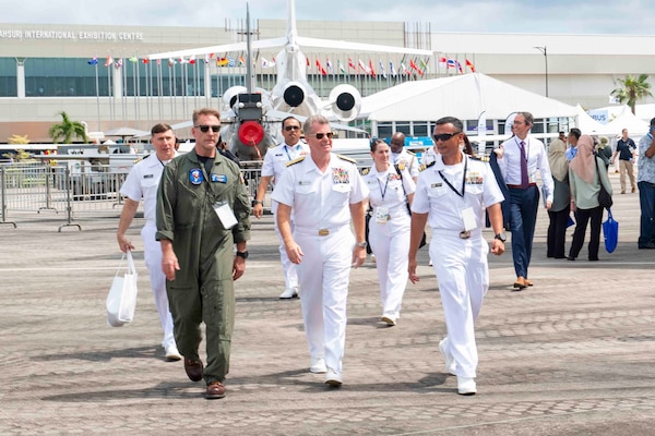 U.S. Navy Cmdr. Eric Reeves, left, and Lt. Cmdr. Chunchun Meares, right, escort Adm. Samuel Paparo, Commander, U.S. Pacific Fleet to static displays during the Langkawi International Maritime and Aerospace Exhibition (LIMA) 2023 Malaysia at the Mahsuri International Exhibition Centre, May 24. LIMA 2023 brings together government and military leaders to promote good will, strengthen cooperation and serve as an ideal platform for world’s navies to showcase their prowess, air and sea power, naval diplomacy, and cooperation in a global arena.