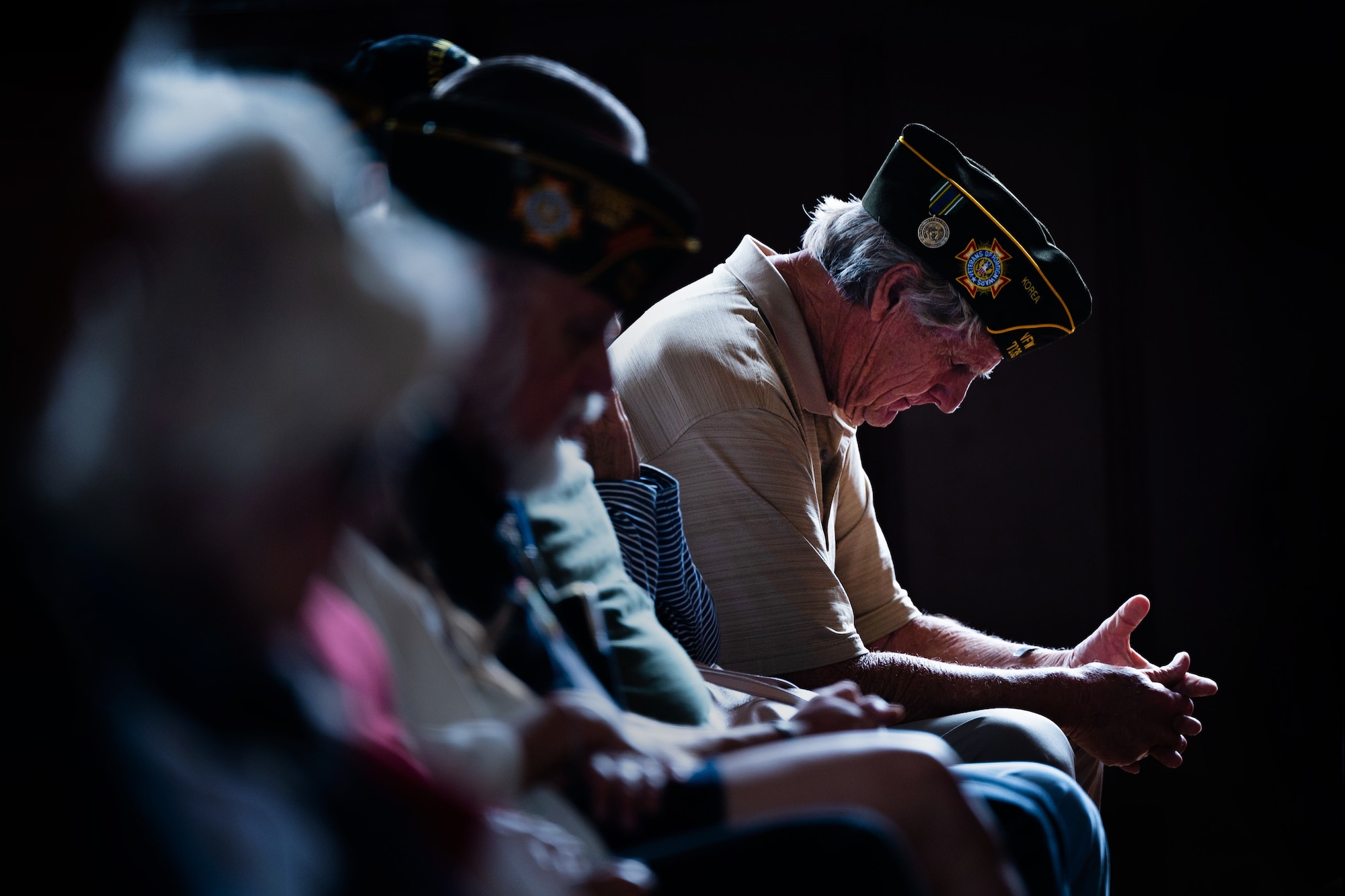 A veteran participates in a moment of silence during a Memorial Day ceremony at the Solvang Veterans Memorial Hall in Solvang, Calif., May 29, 2023. U.S. Space Force Maj. Gen. Douglas A. Schiess, Combined Force Space Component Command commander, gave the keynote speech to over 200 attendees that included veterans from the Global War on Terrorism, Vietnam, Korea and even one veteran from WWII. The ceremony also included the raising on the American Flag by a local Cub Scouts group and a laying of a wreath with a Gold Star family member. (U.S. Space Force photo by Tech. Sgt. Luke Kitterman)