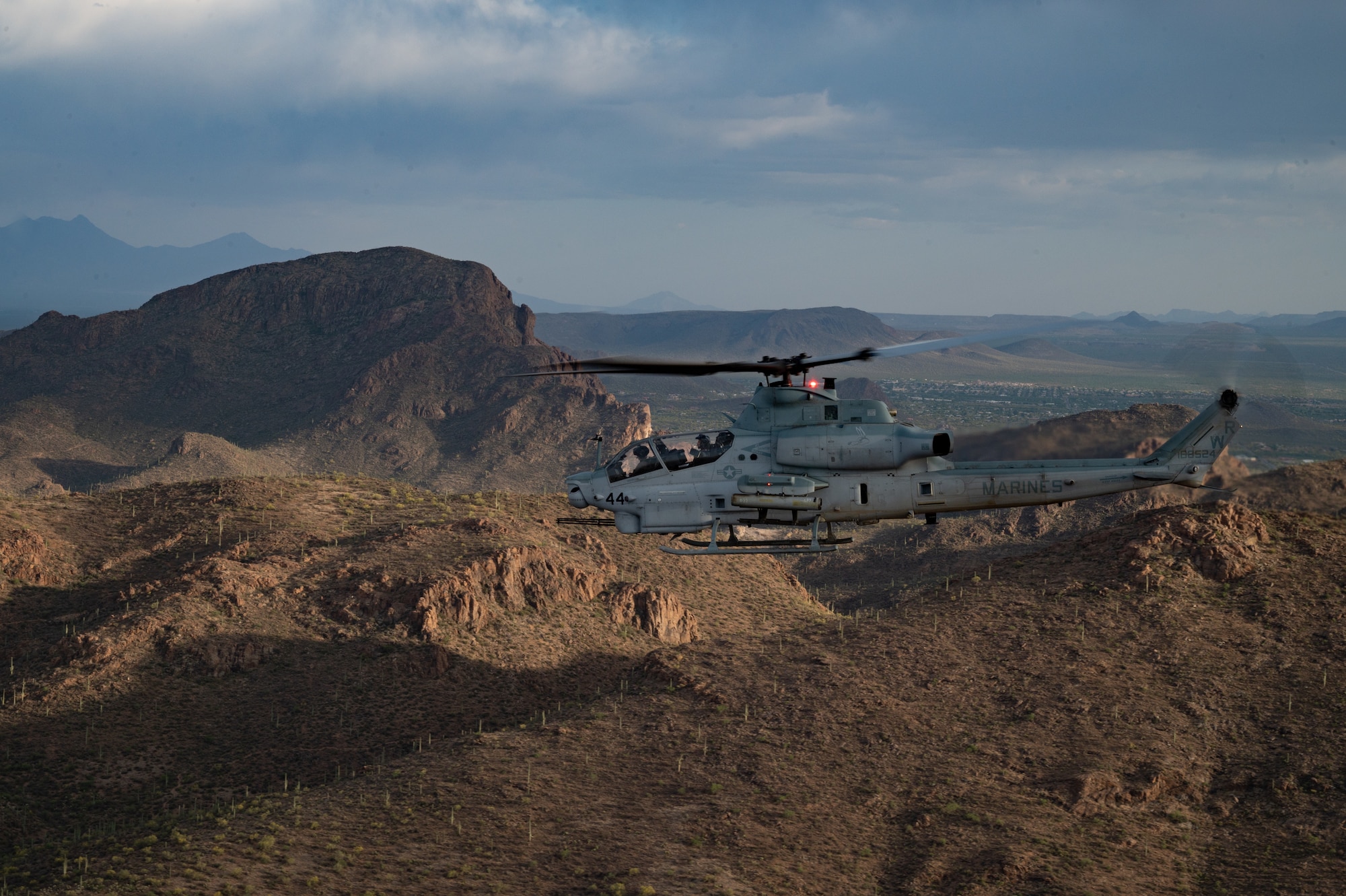 A U.S. Marine Corps AH-1Z Viper helicopter flies over Arizona, May 14, 2023. Various U.S. Marine helicopters and U.S. Navy helicopters took part in an escort mission exercise as part of RED FLAG-Rescue 23-1.  (U.S. Air Force photo by Airman 1st Class Jhade Herrera)