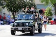 Brig. Gen Richard W. Corner, II, Commanding General, 85th U.S. Army Reserve Support Command, left, and retired Sgt. Maj. Dennis Koski ride in an Army-style jeep, during the annual Arlington Heights Memorial Day parade, May 29, 2023.