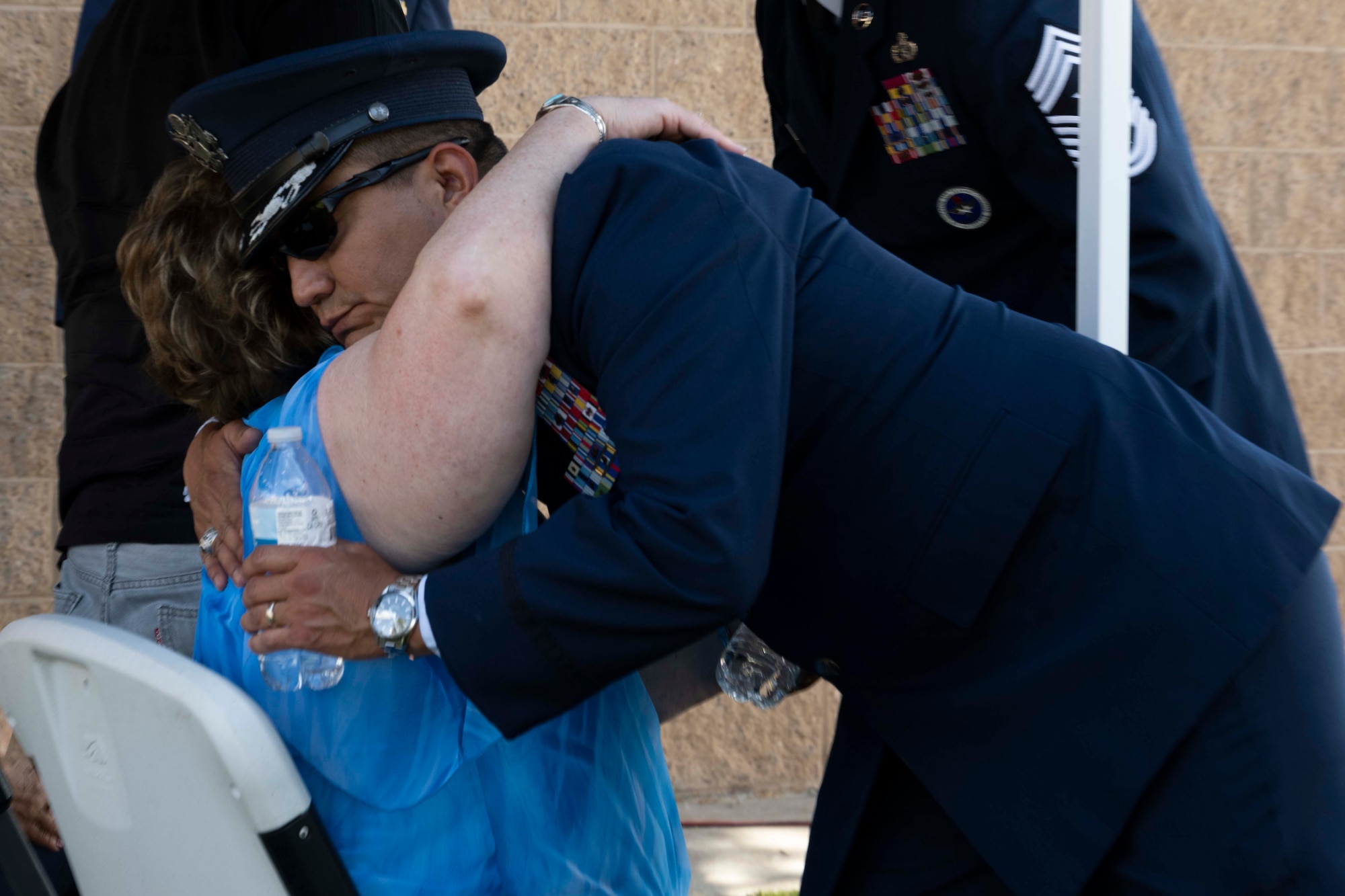 U.S. Air Force Col. Juan Alvarez, 49th Mission Support Group commander, hugs Susan Misener, Gold Star Mom to U.S. Marine Sgt. Garrett A. Misener, 2nd Battalion, 9th Marine Division, during a Memorial Day celebration, at Holloman Air Force Base, New Mexico, May 25, 2023. Holloman honors Gold Star Moms, who are mothers who lost sons or daughters of the United States of Armed Forces.  (U.S. Air Force photo by Airman 1st Class Michelle Ferrari)