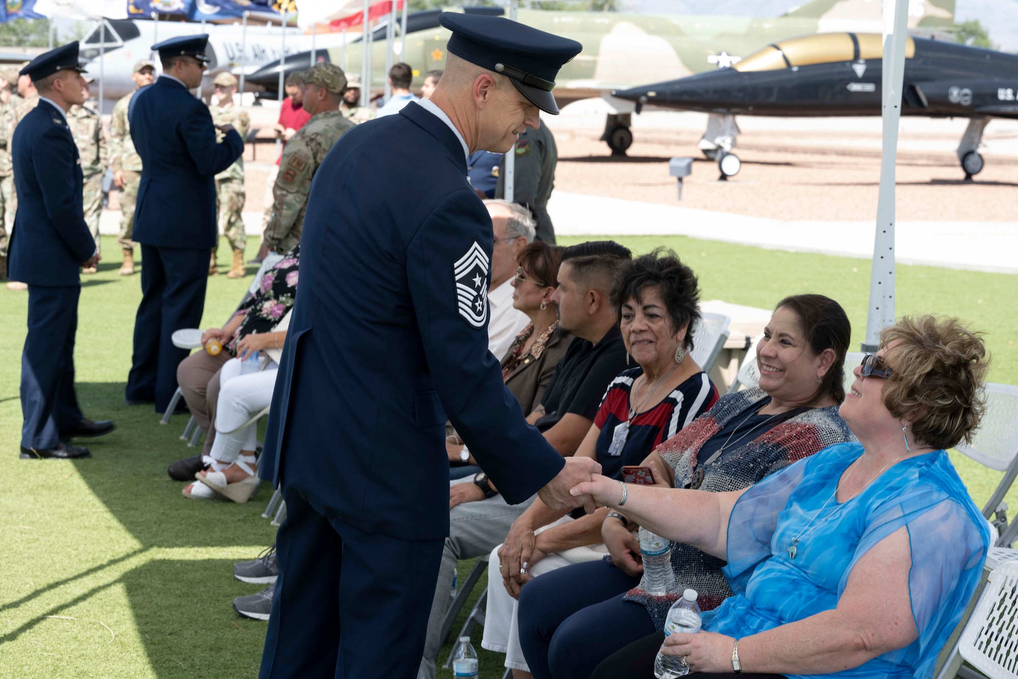 U.S. Air Force Chief Master Sgt. Jeffrey Martin, 49th Wing command chief, shakes the hand of Gold Star Mom, Susan Misener, at Holloman Air Force Base, New Mexico, May 25, 2023. Gold Star Moms are mothers to active-duty service members who die, while serving in the United States Armed Forces. (U.S. Air Force photo by Airman 1st Class Michelle Ferrari)