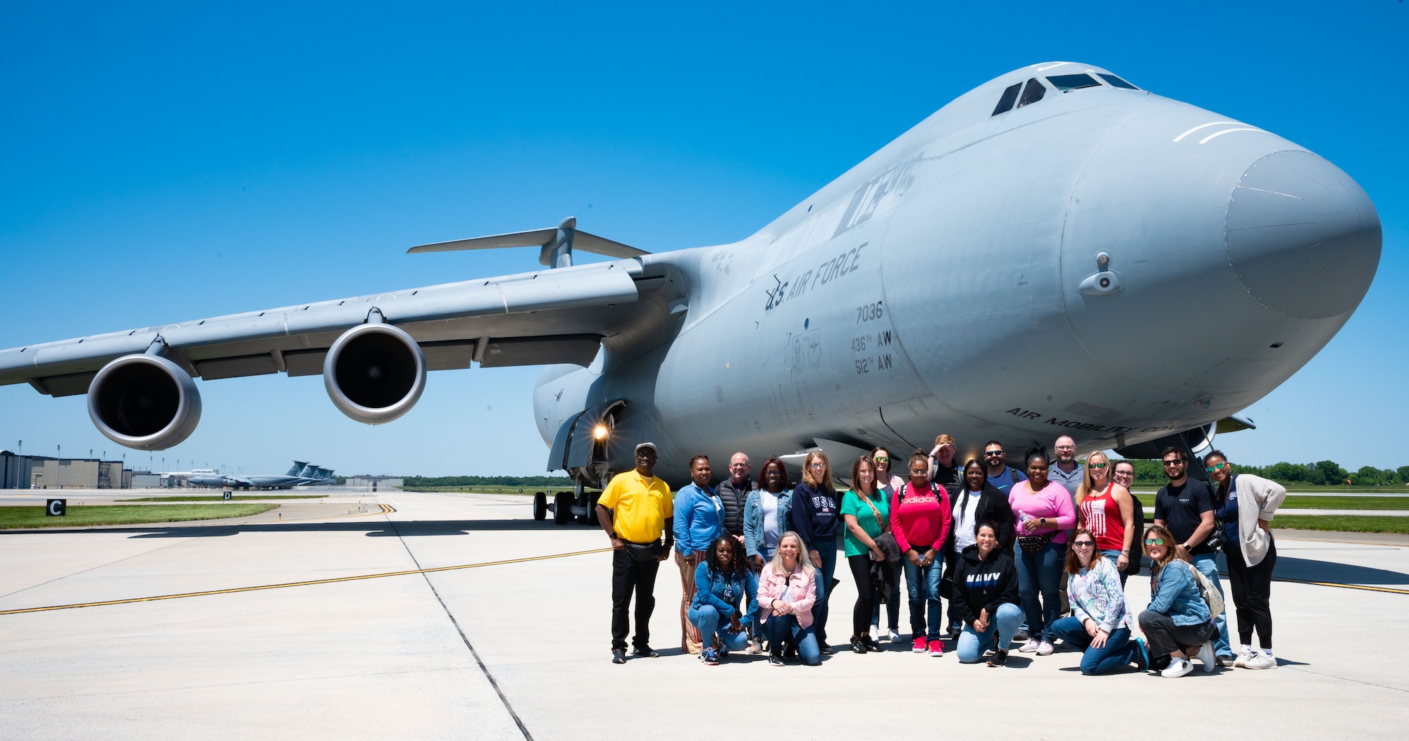 Central Delaware Chamber of Commerce Leadership Central Delaware program members pose for a group photo in front of a C-5M Super Galaxy at Dover Air Force Base, Delaware, May 25, 2023. The LCD members were given the opportunity to see an aerial refueling training mission with the 9th Airlift Squadron, witnessing firsthand how Dover AFB trains to deliver cargo around the globe. (U.S. Air Force photo by Airman 1st Class Amanda Jett)