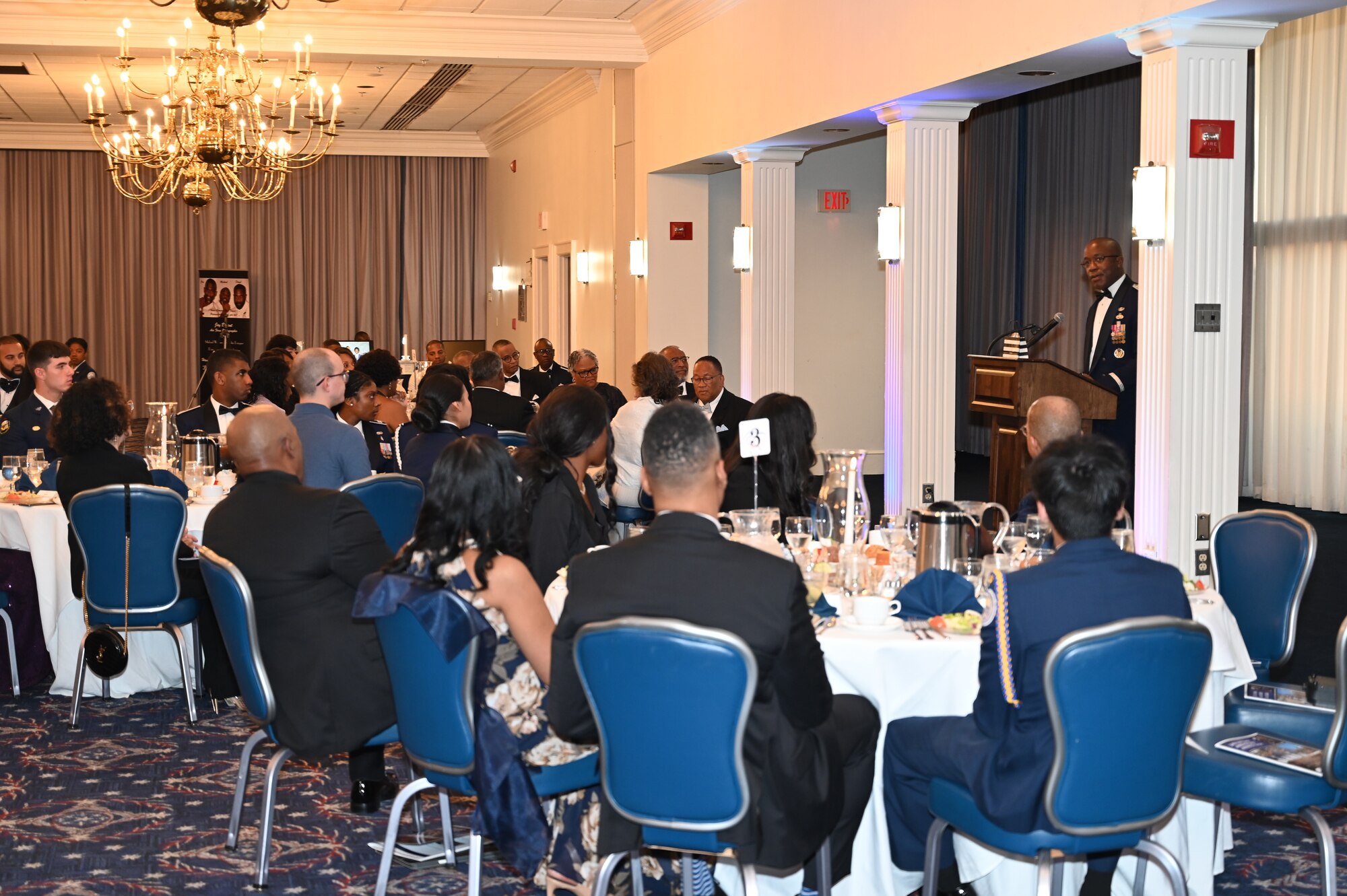 Lt. Gen. Stacy Hawkins, Air Force Sustainment Center Commander, gives the keynote speech at the 34th Annual Air Force Cadet Officer Mentor Association’s (AFCOMA) Anniversary Awards Gala to a room filled with ROTC cadets, AFCOMA members and alum, and their families on May 6, 2023, at Joint Base Anacostia-Bolling.