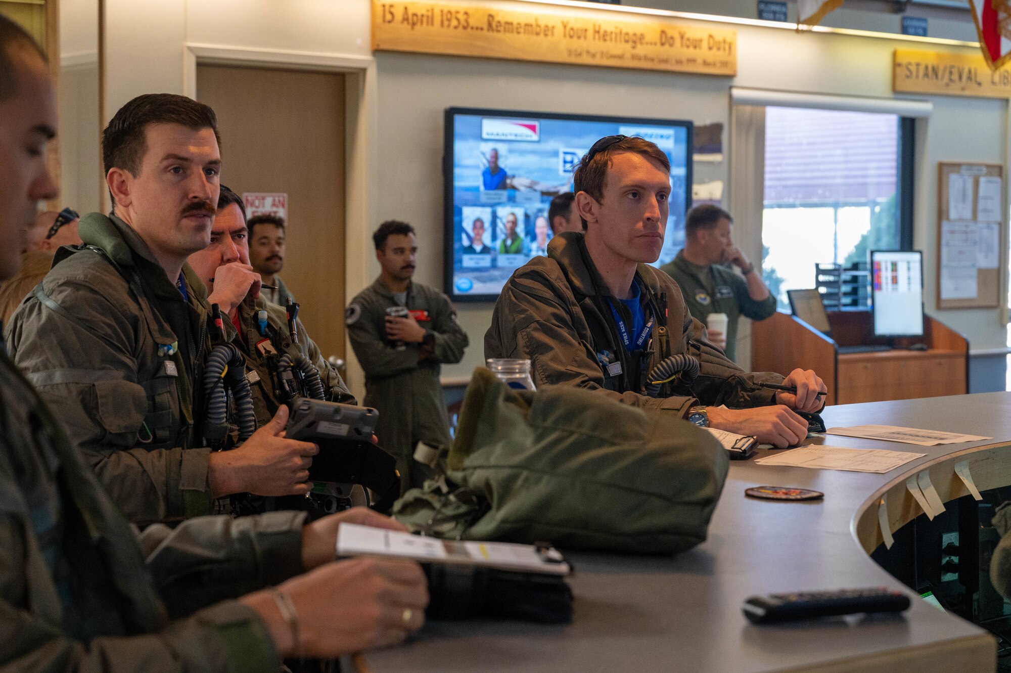 U.S. Air Force Airmen assigned to the 173rd Fighter Wing, Kingsley Field Air National Guard Base, Oregon, and the 56th Fighter Wing, Luke Air Force Base, Arizona, listen to a pre-flight weather brief May 15, 2023, at Kingsley Field ANGB, Oregon.