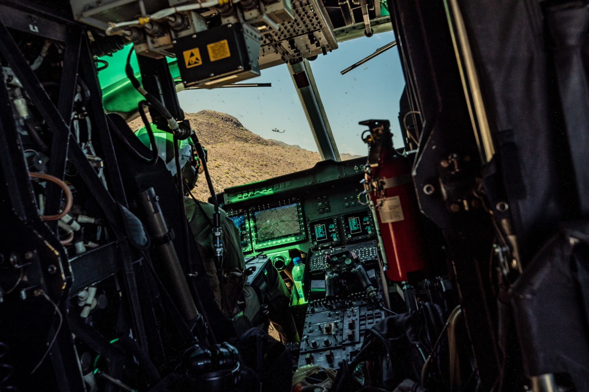 A U.S. Marine Corps UH-1Y Venom helicopter follows a U.S. Marine Corps AH-1Z Viper helicopter over Arizona, May 14, 2023. Various U.S. Marine helicopters and U.S. Navy helicopters took part in an escort mission exercise as part of RED FLAG-Rescue 23-1.  (U.S. Air Force photo by Airman 1st Class Jhade Herrera)