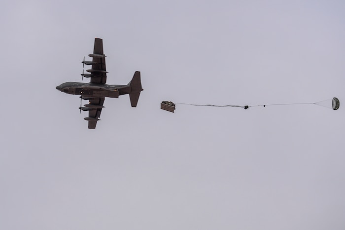 A U.S. Air Force HC-130J Combat King II from the 79th Rescue Squadron drops a Humvee during the 563rd Operations Support Squadron’s aerial delivery and recovery training at Fort Huachuca, Ariz., Dec. 9, 2015. This training marked the first time any rescue operations support squadron packaged and rigged a heavy vehicle without external assistance and the first time a heavy vehicle was dropped by the 79th RQS. (U.S. Air Force photo by Senior Airman Chris Massey)
