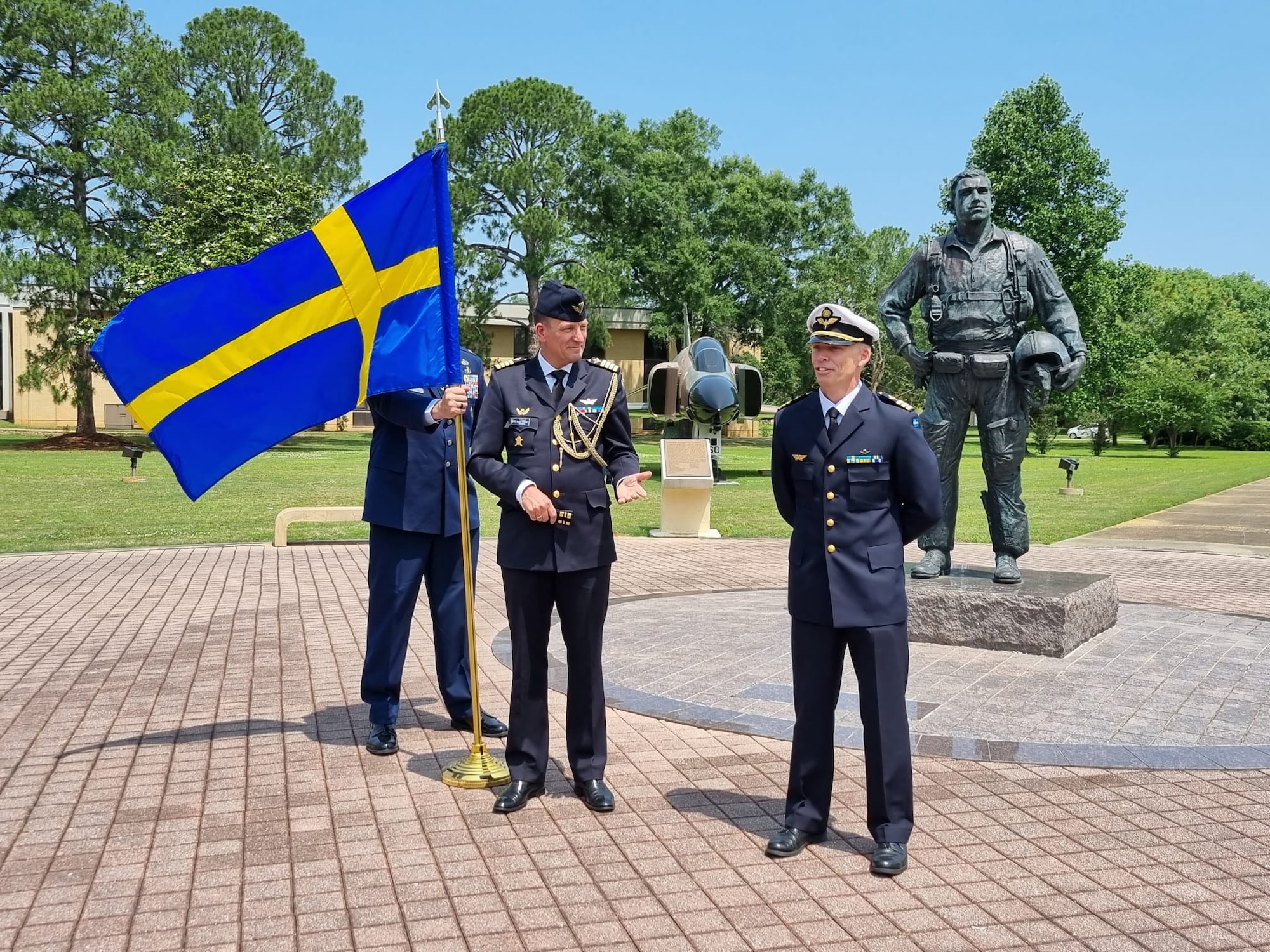 New Air Command and Staff College graduate Swedish Royal Air Force Lt. Col. Johan Jeppsson (right) offers a few words following his outdoor promotion ceremony at Air University, Maxwell Air Force Base, Alabama, May 25, 2023. Col. Jonas Nellsjo (left), air and space attaché, assistant defense attaché, Embassy of Sweden, promoted Jeppsson to his rank of lieutenant colonel.