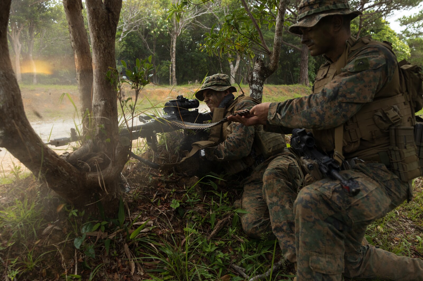 U.S. Marines with 3d Battalion, 6th Marines fire an M240B machine gun during unit-level training at the Central Training Area in Okinawa, Japan, on May 13, 2023. This routine training is focused on inserting multiple reinforced platoons for the defense of key maritime terrain and rehearsing stand in force tactics and techniques as an Alert Contingency Marine Air Ground Task Force against a peer adversary. 3/6 is forward deployed in the Indo-Pacific under 4th Marine Regiment, 3d Marine Division as part of the Unit Deployment Program. (U.S. Marine Corps photo by Lance Cpl. Jaylen Davis)