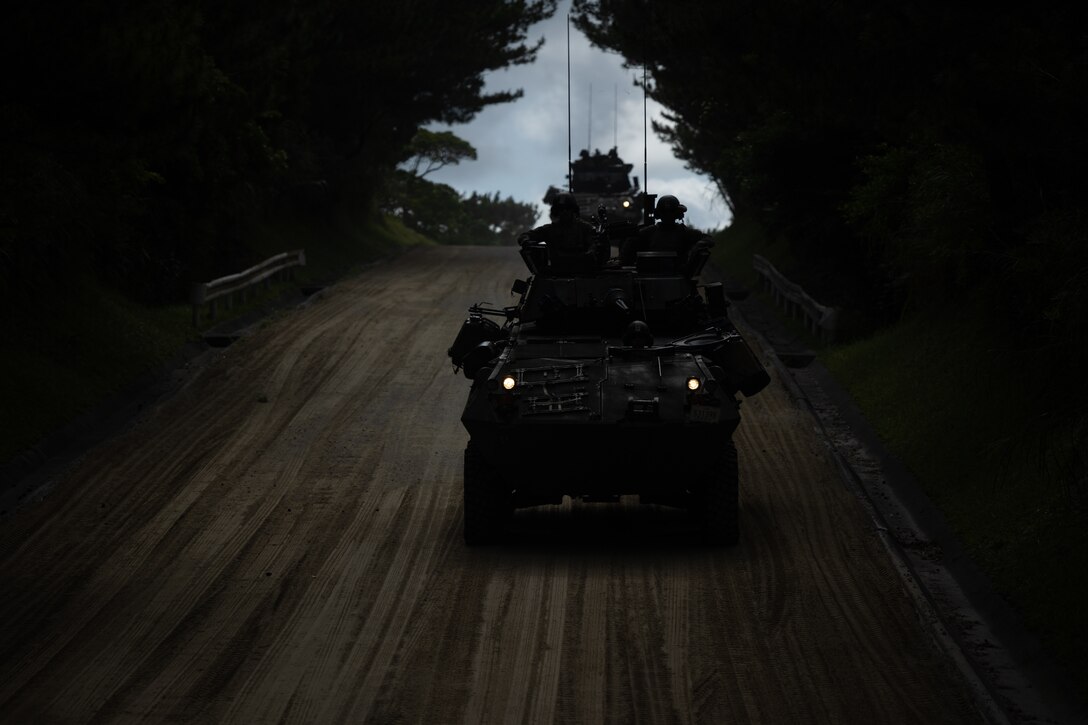 U.S. Marines maneuver aboard their Light Armored Vehicle (LAV) 25 during a crew served gunnery range at Camp Schwab, Okinawa, Japan, May 20, 2023. The range was executed to maintain proficiency and increase lethality of the Marines in the first island chain. The Marines and LAV are with 3d Light Armored Reconnaissance Battalion, currently forward deployed in the Indo-Pacific under 4th Marine Regiment, 3d Marine Division as part of the Unit Deployment Program. (U.S. Marine Corps photo by Cpl. Israel Sheber)