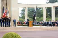 COLLEVILLE-SUR-MER, France - Rear Adm. Oliver T. Lewis, Director of Maritime Operations, U.S. Naval Forces Europe-Africa / U.S. Sixth Fleet, delivers keynote remarks at the Memorial Day commemoration ceremony honoring the American servicemembers that died in the invasion of Normandy, at the Normandy American Cemetery and Memorial in Colleville-sur-Mer, France, May 28, 2023. Admirals from U.S. Naval Forces Europe-Africa, U.S. Sixth Fleet, and EURAFCENT, traveled throughout Europe visiting American Battle Monuments Commission cemeteries to honor the lives and legacies of fallen U.S. and allied service members that paid the ultimate sacrifice in the service of their countries. Headquartered in Naples, Italy, NAVEUR-NAVAF operates U.S. naval forces in the U.S. European Command (USEUCOM) and U.S. Africa Command (USAFRICOM) areas of responsibility. U.S. Sixth Fleet is permanently assigned to NAVEUR-NAVAF and employs maritime forces through the full spectrum of joint and naval operations.
