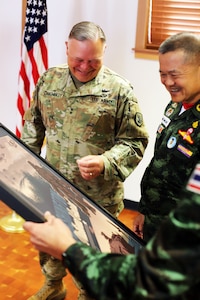 Gen. Narongpan Jittkaewtae, commander in chief, Royal Thai Army, and Maj. Gen. Bret Daugherty, the adjutant general, share a laugh at the Washington National Guard Museum at Camp Murray, Wash., on May 25, 2023. During the visit to Camp Murray, Jittkaewtae and his staff got a better understanding of the Washington National Guard’s force structure, training and abilities.